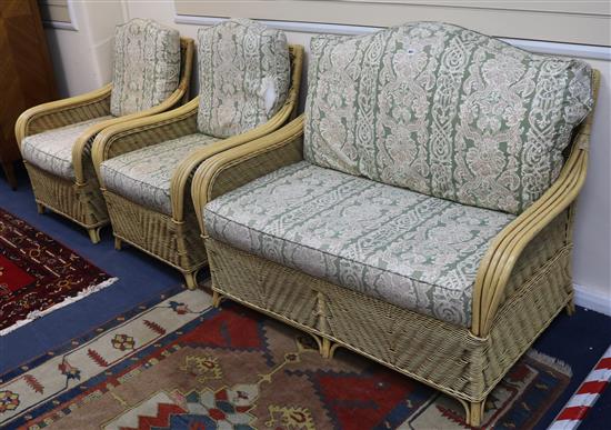 A three piece rattan suite	